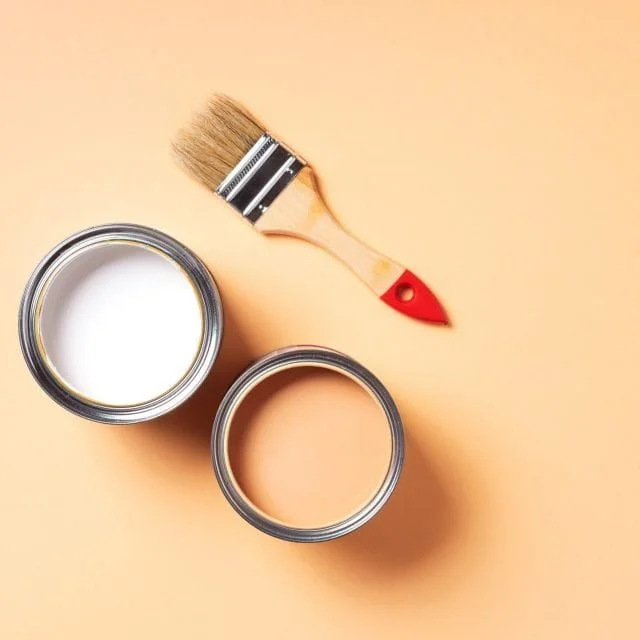 Paint brush and open paint can with on pastel background. Top view, copy space. Appartment renovation, repair, building and home design concept